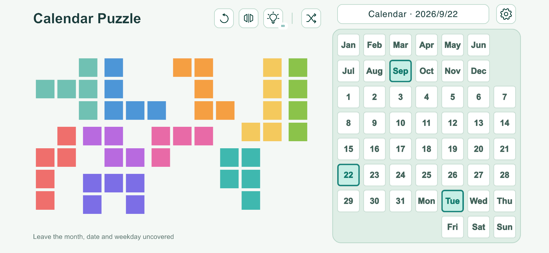 Calendar Puzzle: colorful puzzle pieces beside a calendar board, with September, 22 and Tuesday highlighted.